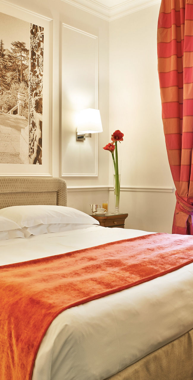 Elegant hotel room with red accents
