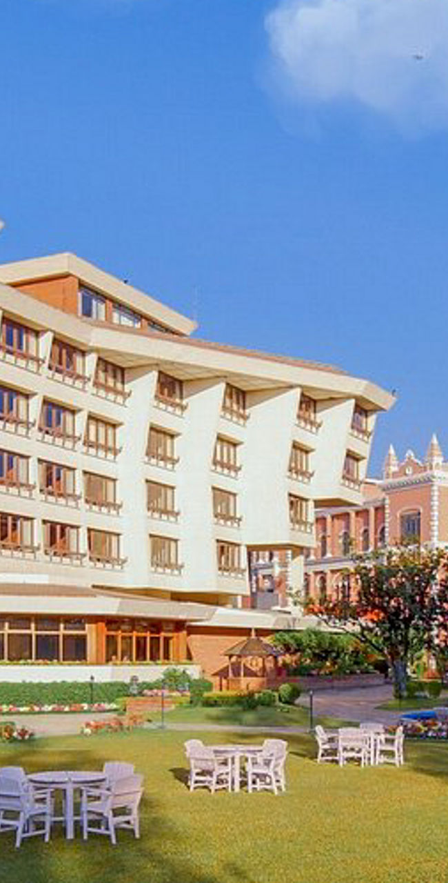 Luxury hotel with garden and seating area