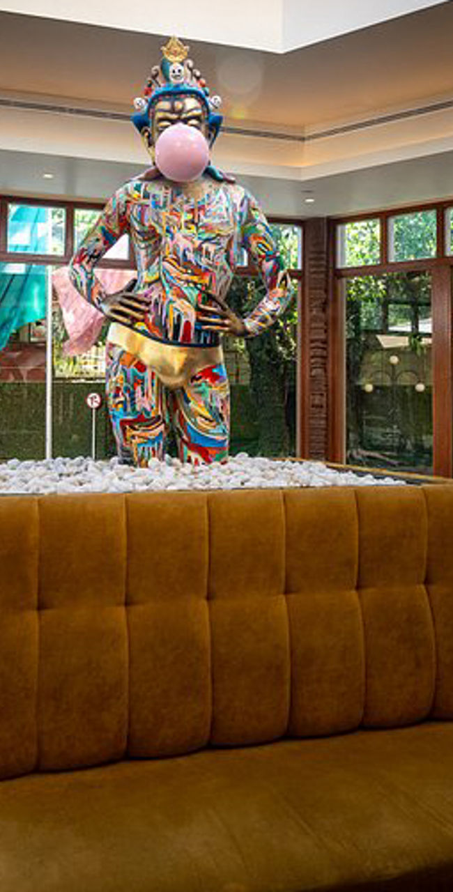 Modern lounge with colorful statue centerpiece