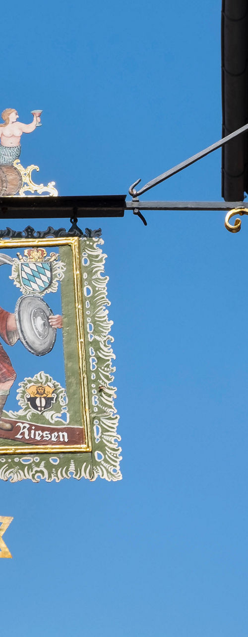Decorative sign with historic artwork