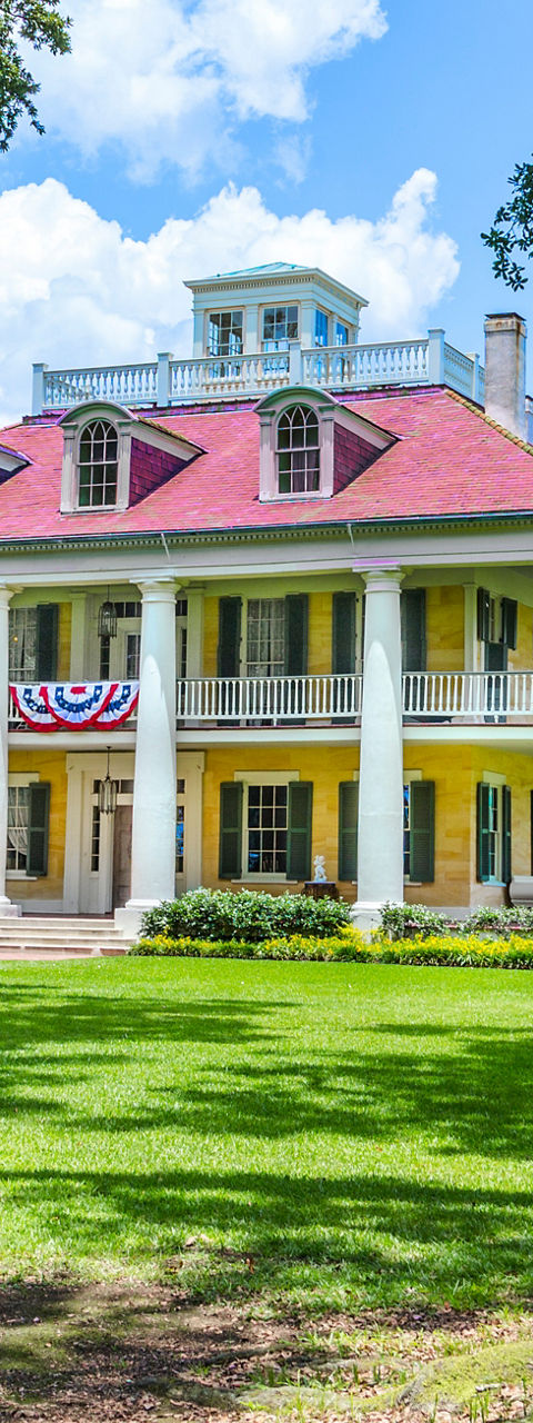 Historic mansion with vibrant yellow facade