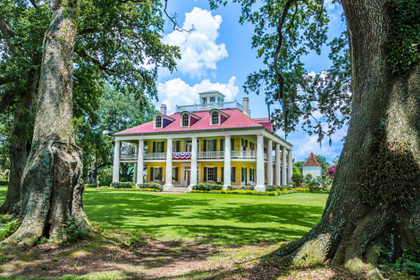 Historic mansion with vibrant yellow facade