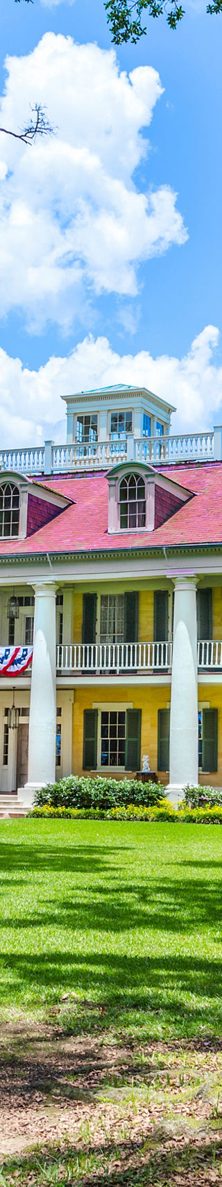Historic mansion with vibrant yellow facade