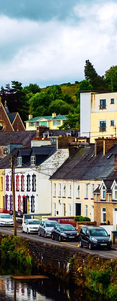 Colorful riverside town with church view