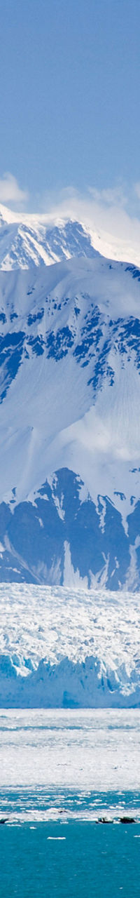 Snow-covered mountains and icy glacier view