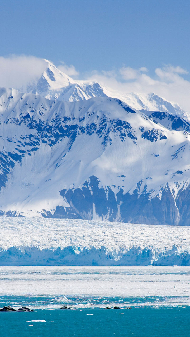 Snow-covered mountains and icy glacier view