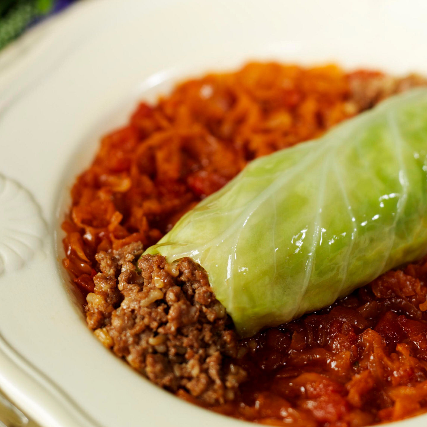 Stuffed cabbage roll on white plate