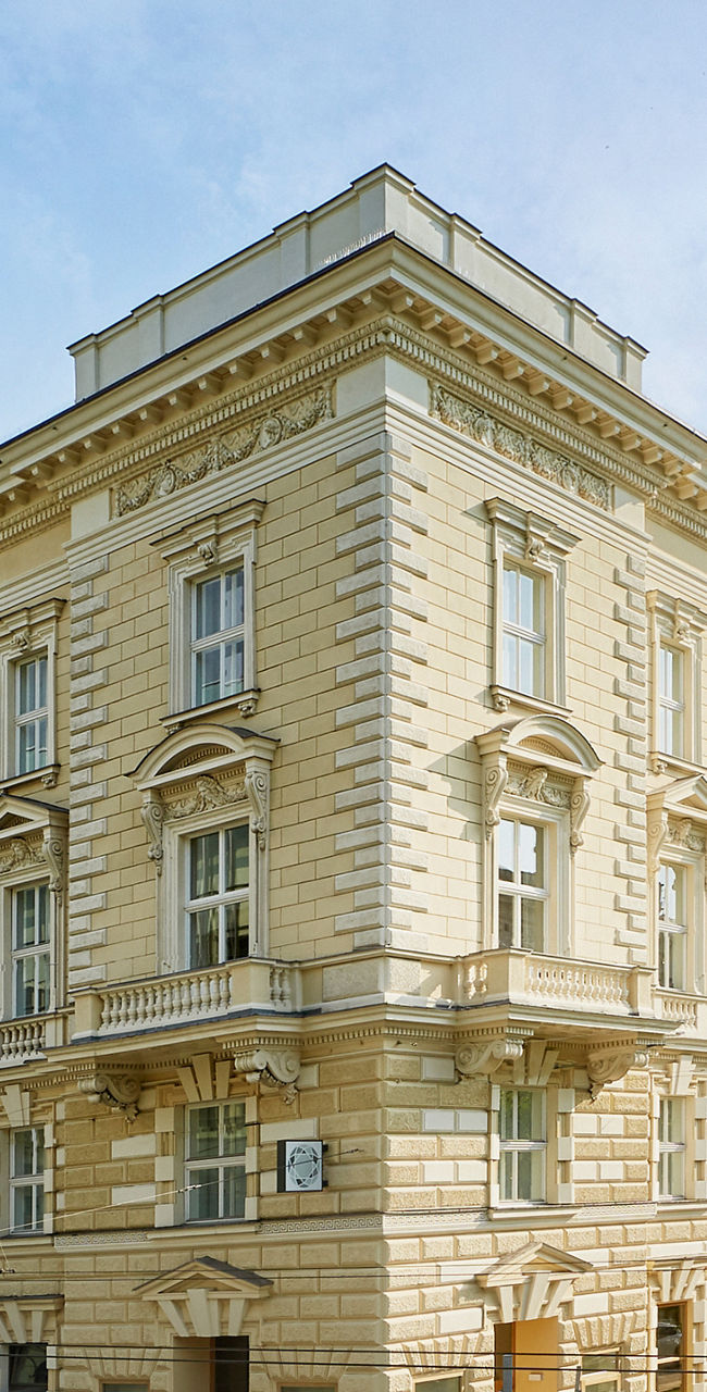 Historic building on sunny urban street