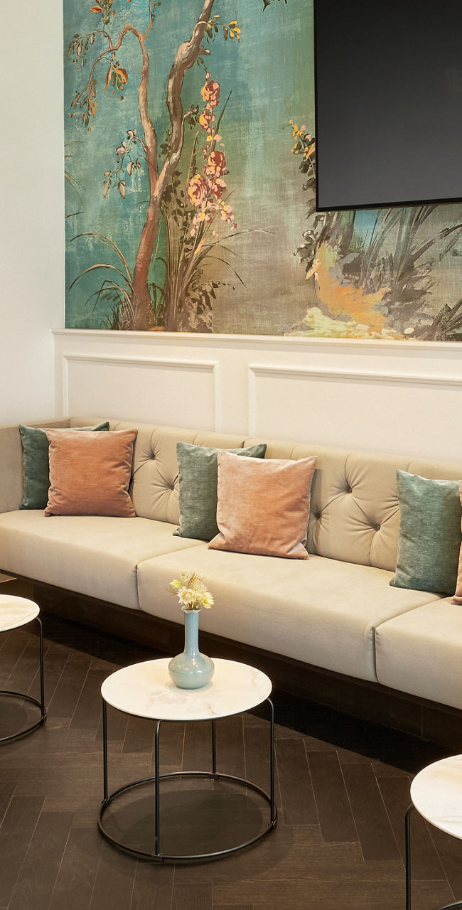 Modern lounge with wall mural and TV