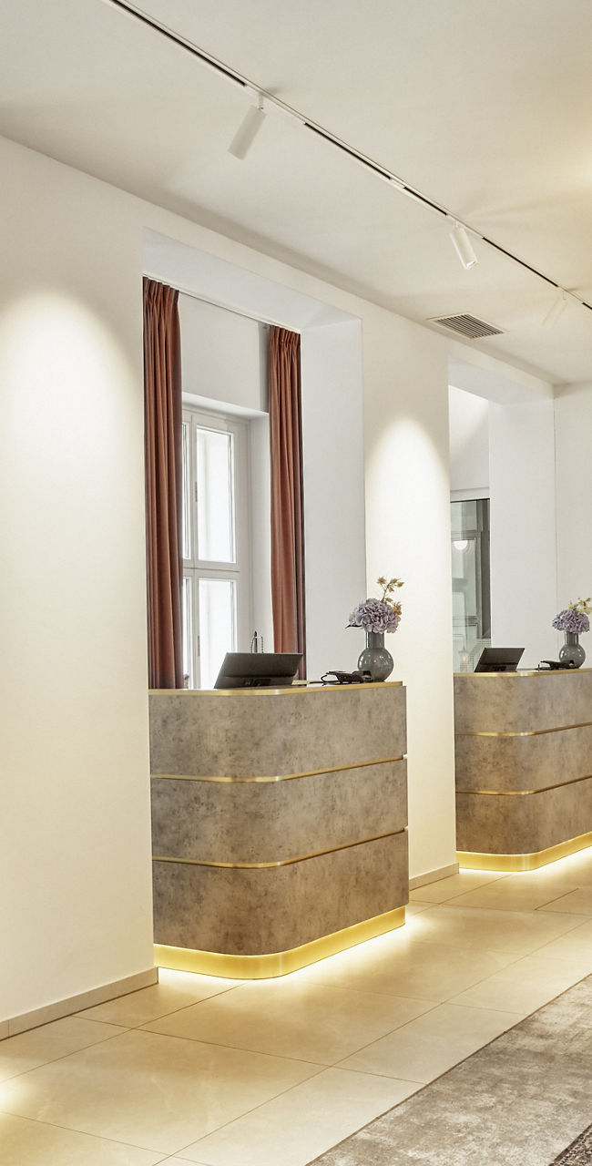 Modern hotel lobby with reception desks