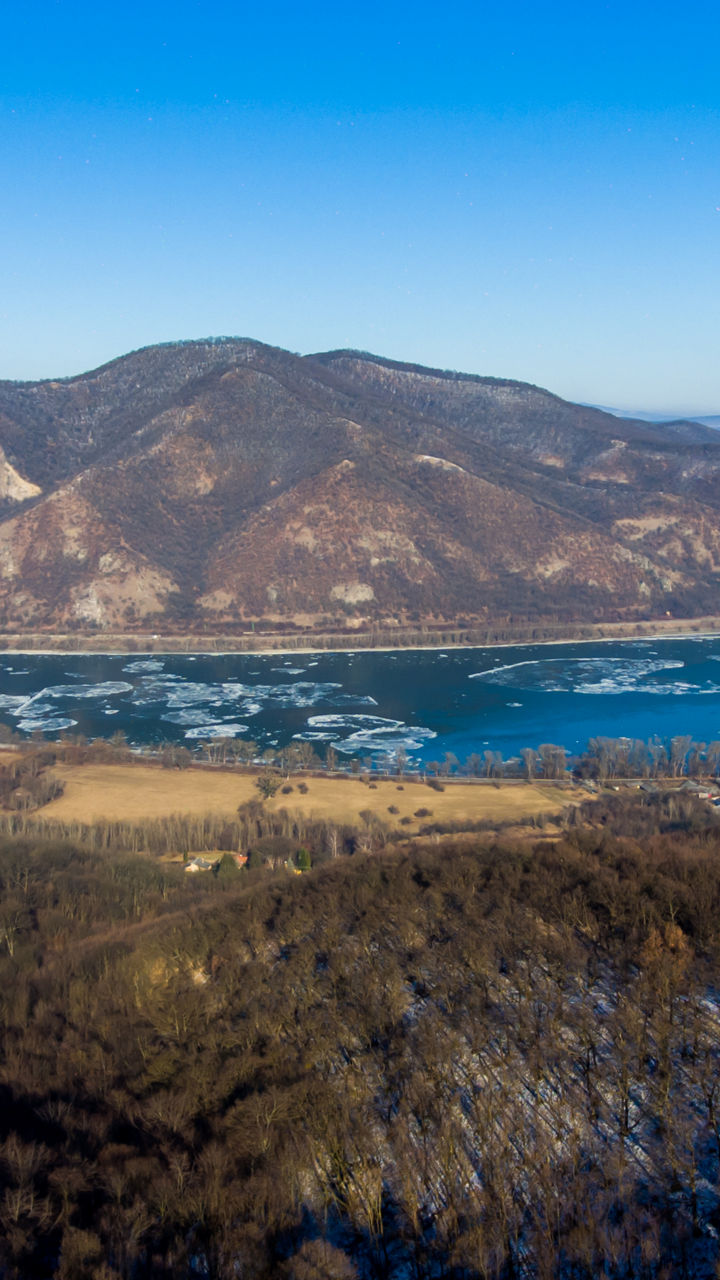 Aerial view of river bend and mountain