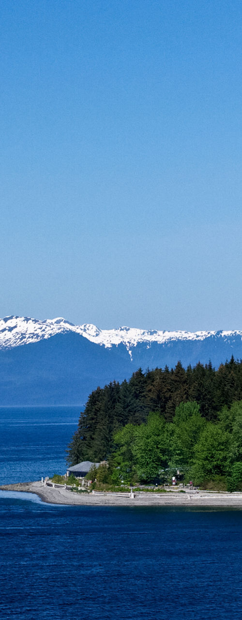 Scenic coastal view with snowy mountains