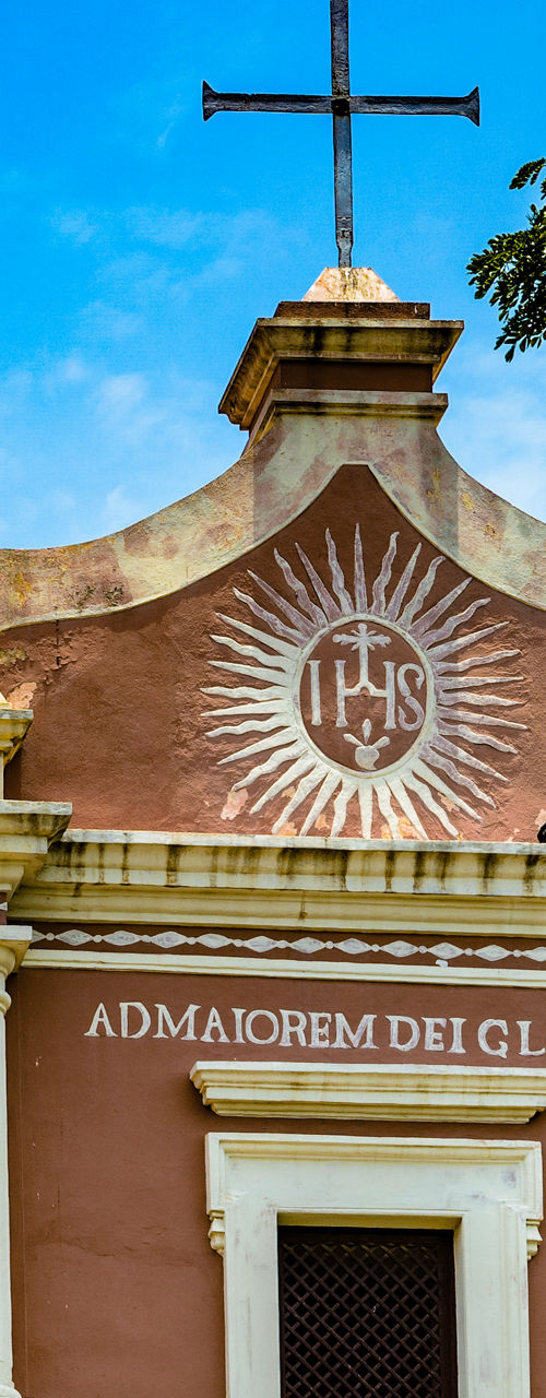 Historic church facade with religious emblem