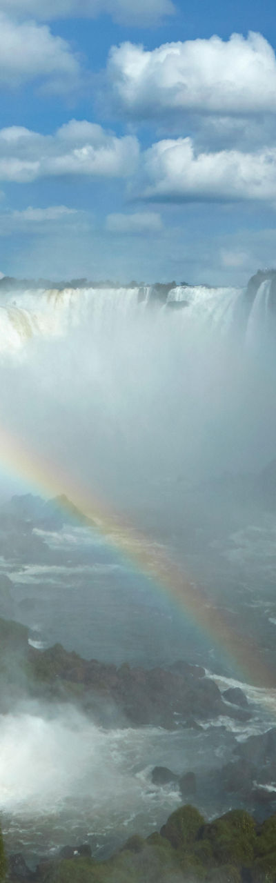 Majestic waterfall with vibrant rainbow