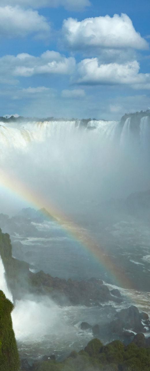 Majestic waterfall with vibrant rainbow