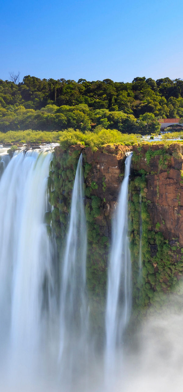 Majestic Iguazu Falls under clear blue sky