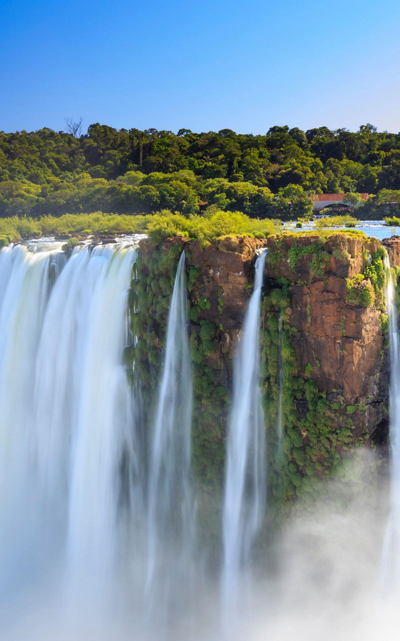 Majestic Iguazu Falls under clear blue sky