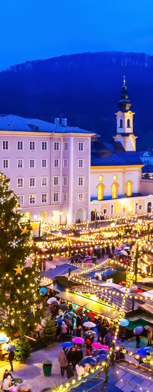 Festive Christmas market in Salzburg at dusk