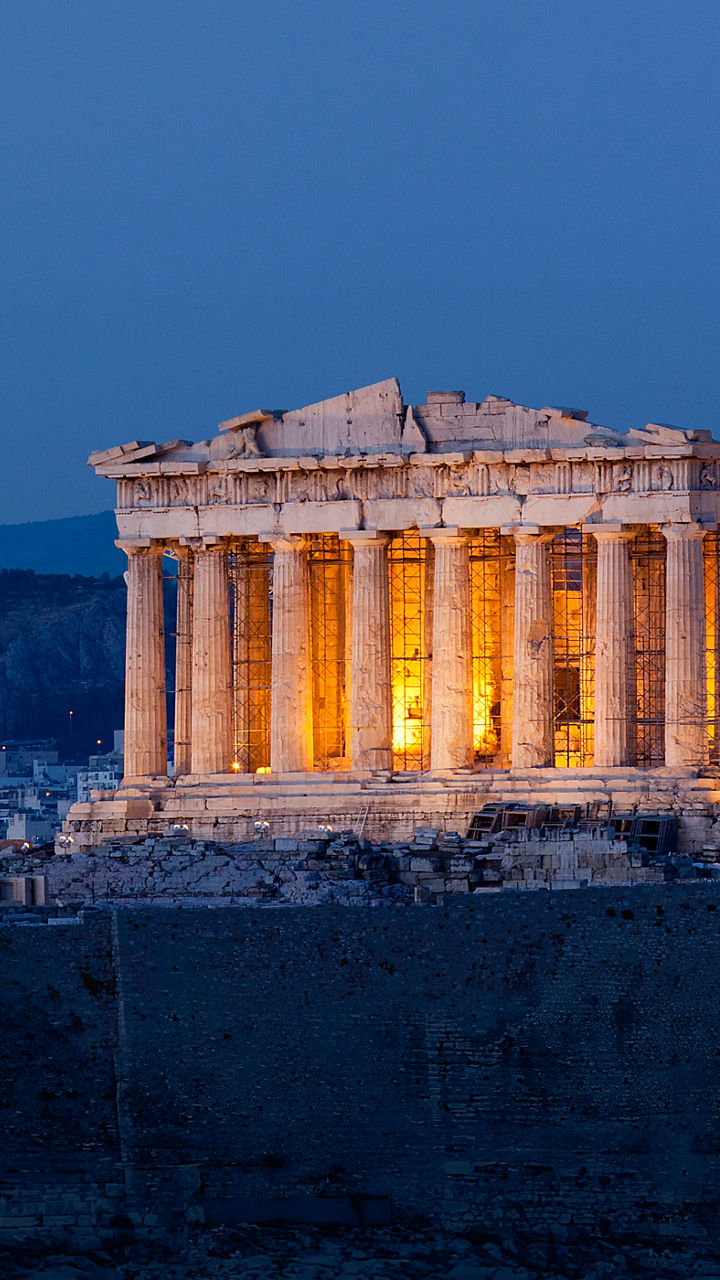Illuminated Parthenon at dusk in Athens