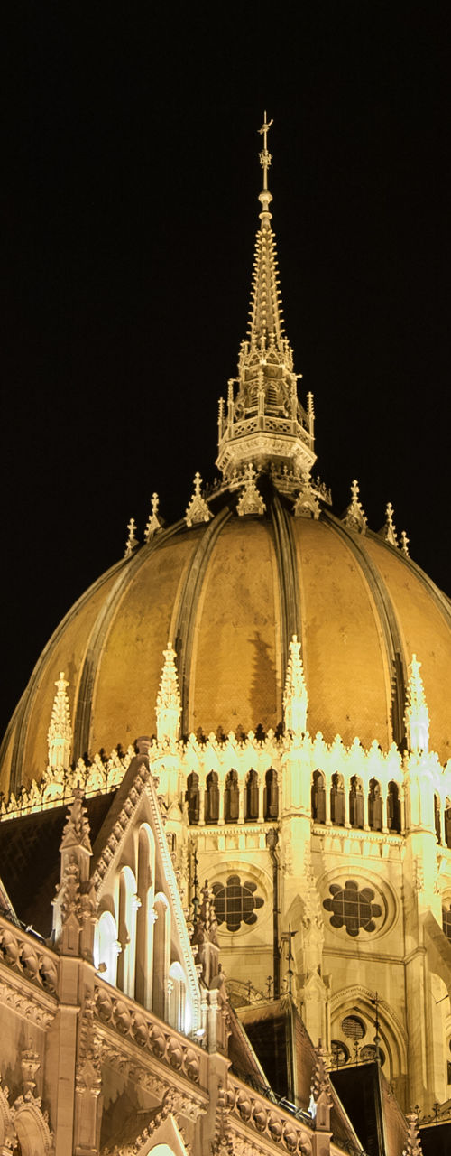 Illuminated Gothic architecture at night