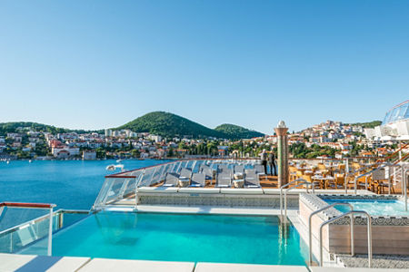 Luxury pool overlooking scenic coastal town