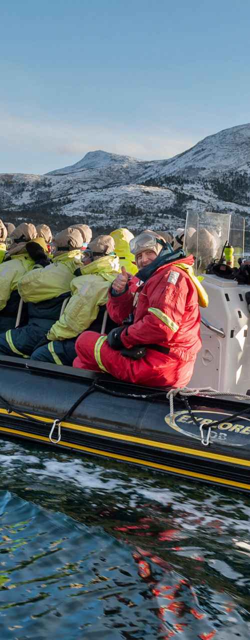 Group on Yamaha boat in scenic fjord