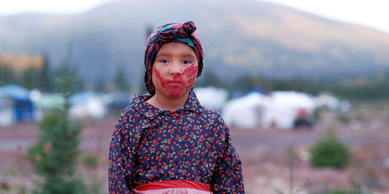 Young girl in traditional attire outdoors