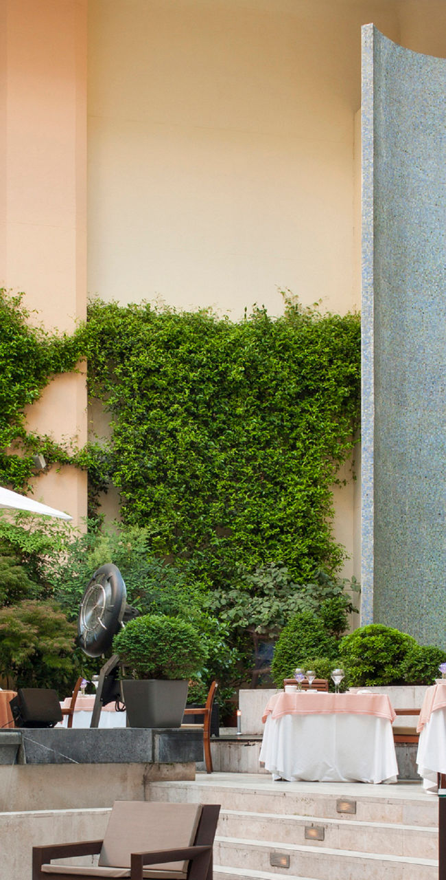 Elegant outdoor dining area with sculpture