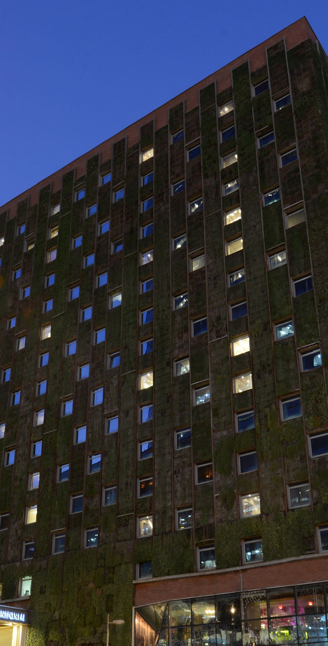 Modern urban building with green facade