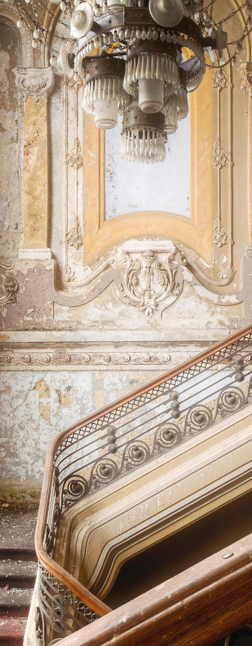 Grand staircase in abandoned ornate historic building