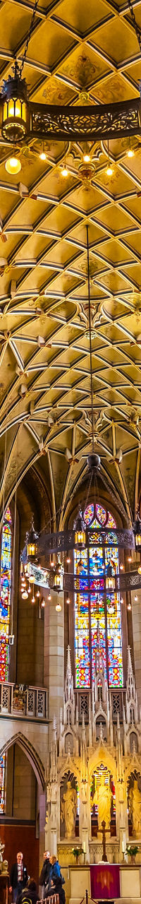 Colorful gothic cathedral interior with vaulted ceiling