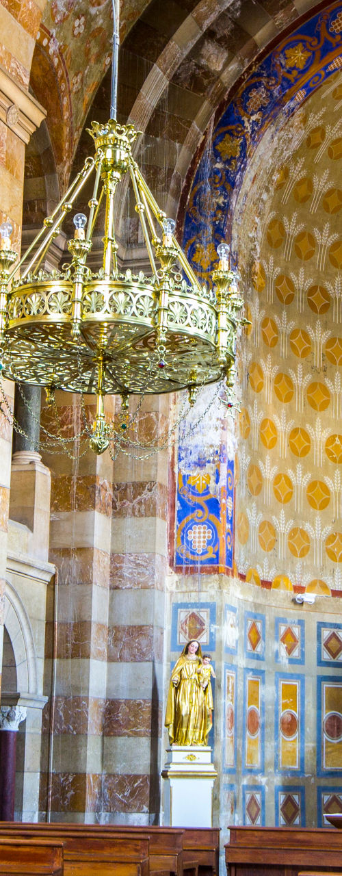 Ornate church interior with golden chandelier