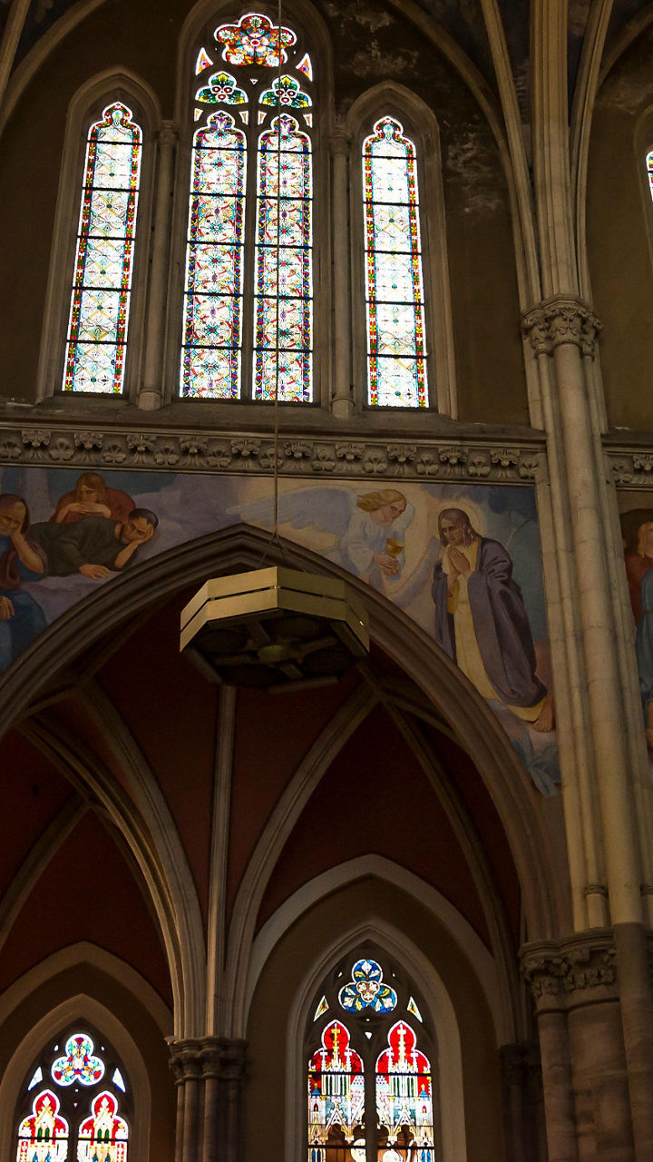 Gothic cathedral interior with stained glass