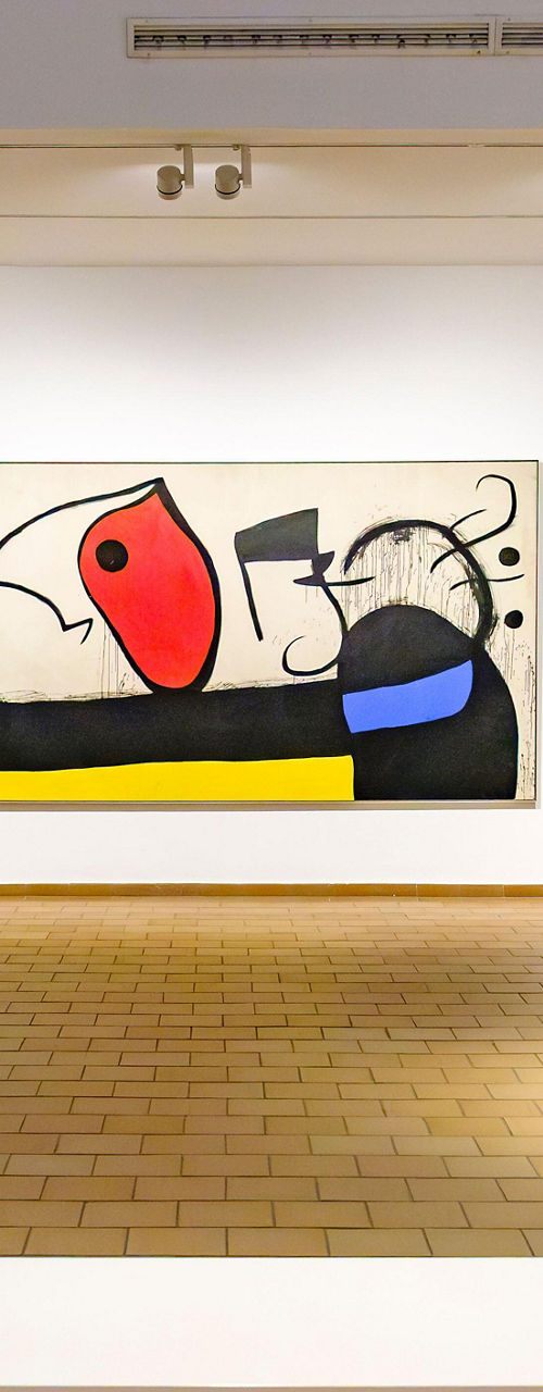 Modern art gallery with abstract paintings