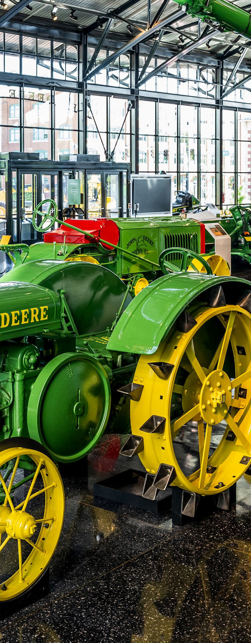 John Deere tractors in modern showroom