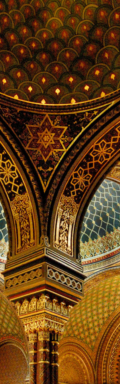 Ornate synagogue interior with visitors
