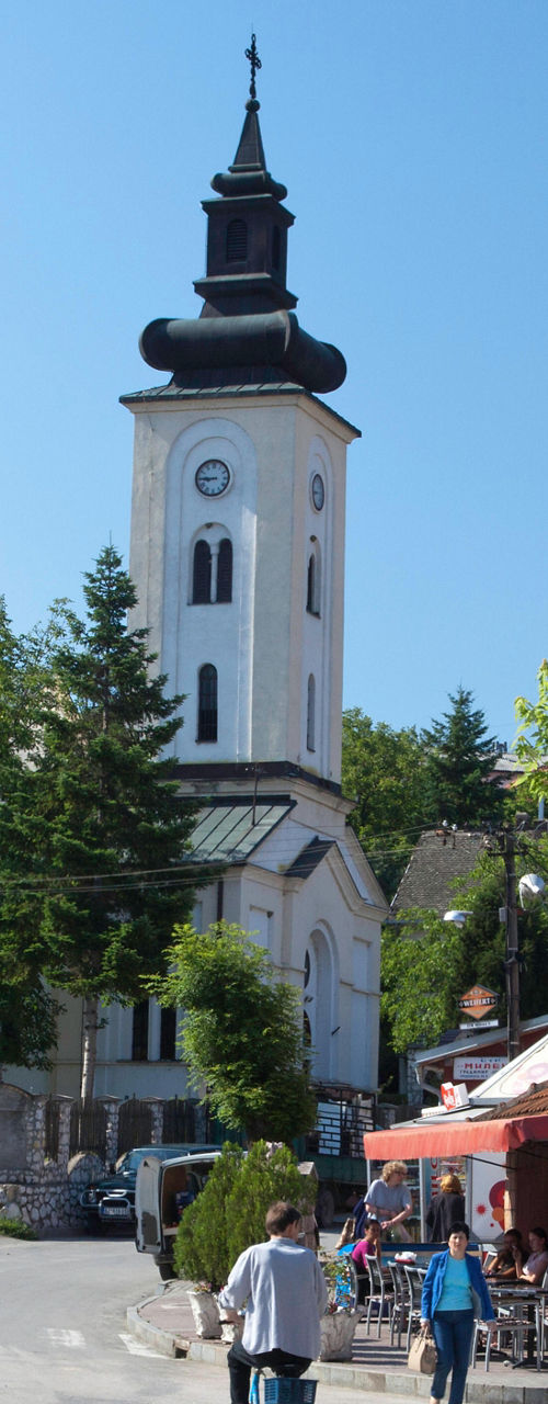 Charming village street with church tower