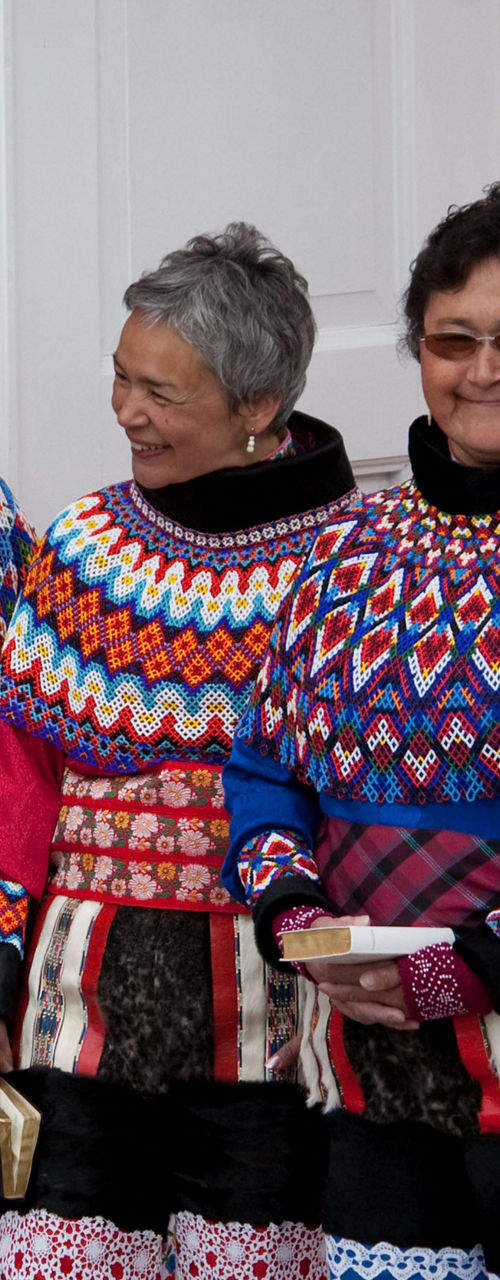 Traditional Greenlandic attire with ceremonial gathering
