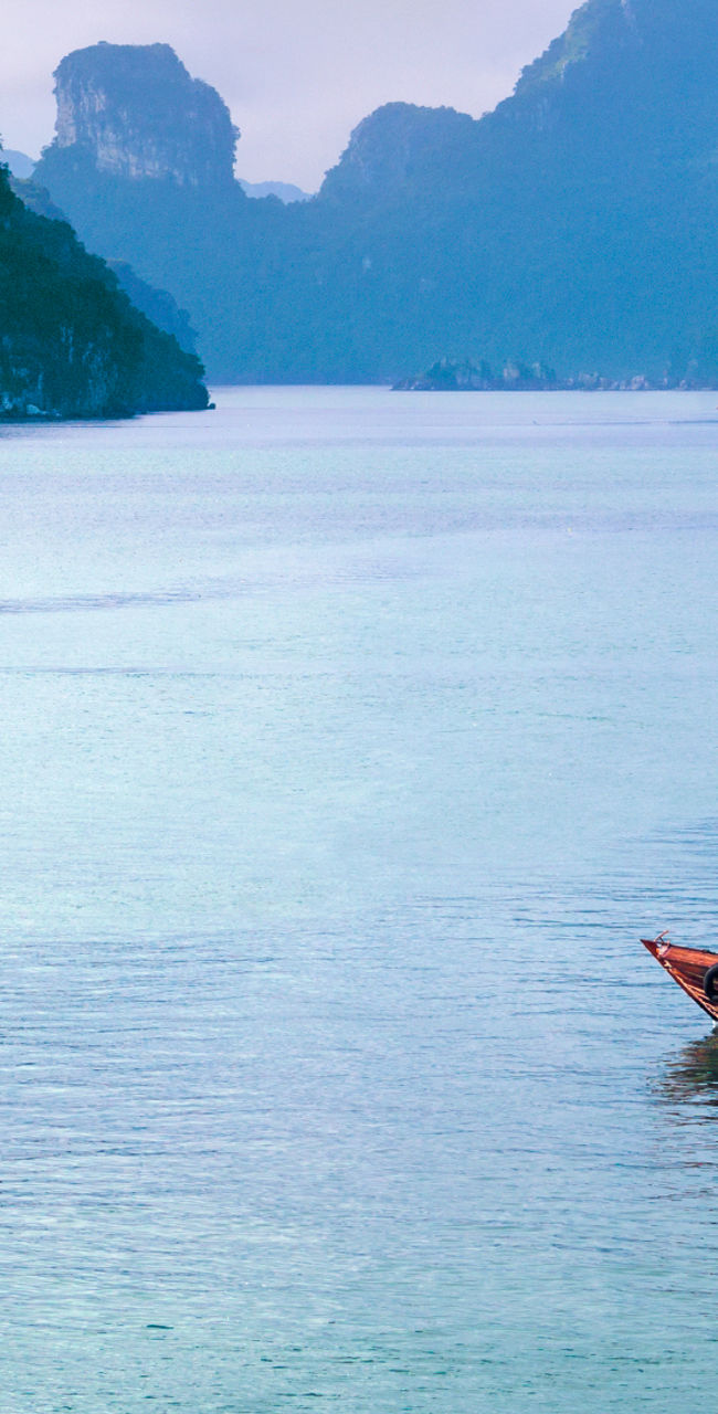 Scenic tropical bay with traditional boat