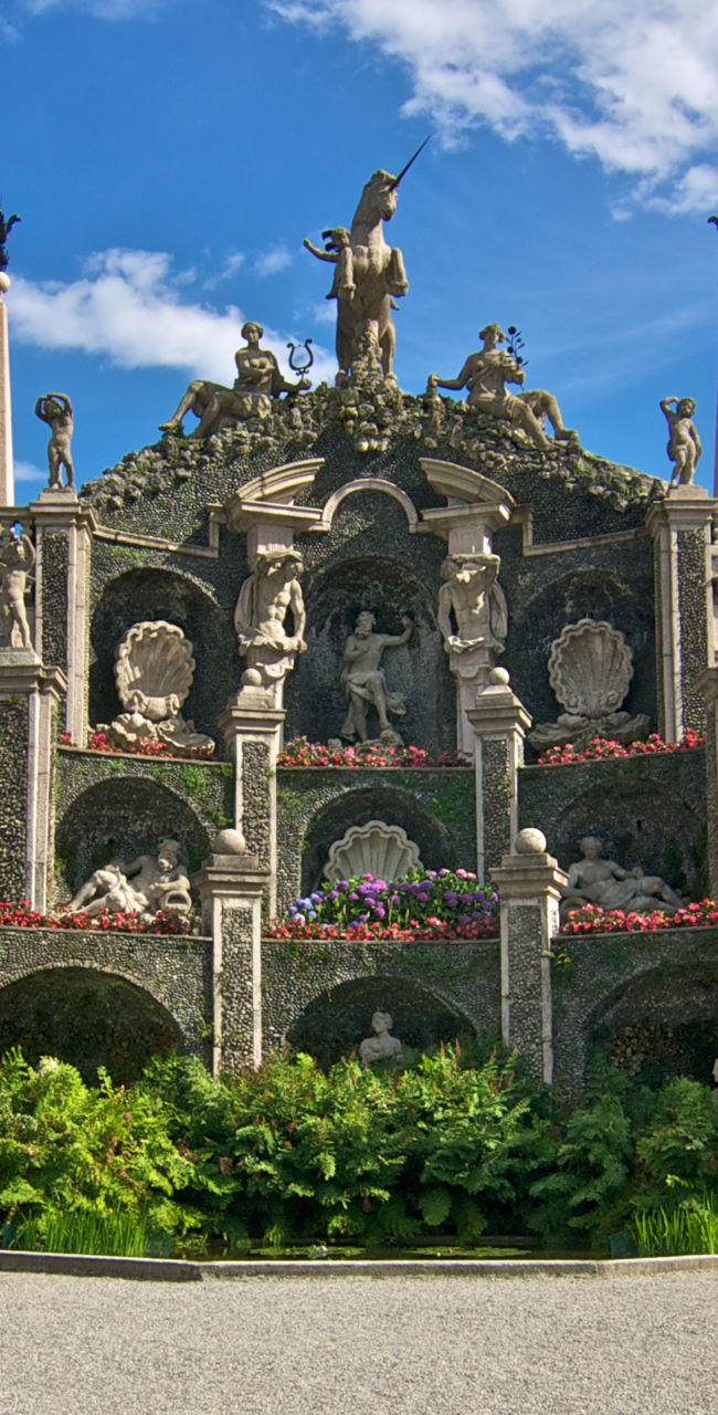 Ornate Italian garden with statues and arches