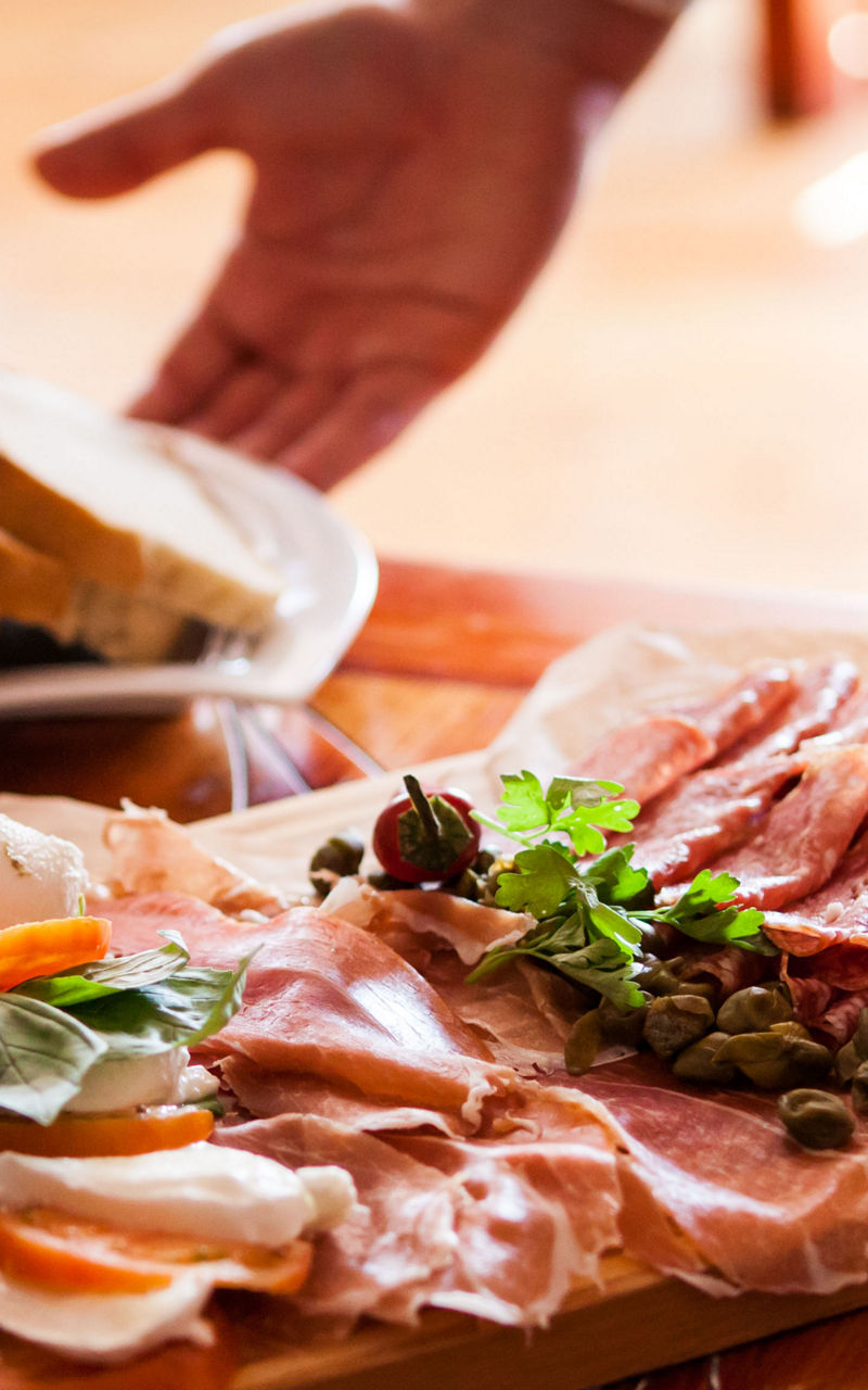 Charcuterie board with bread and olive oil