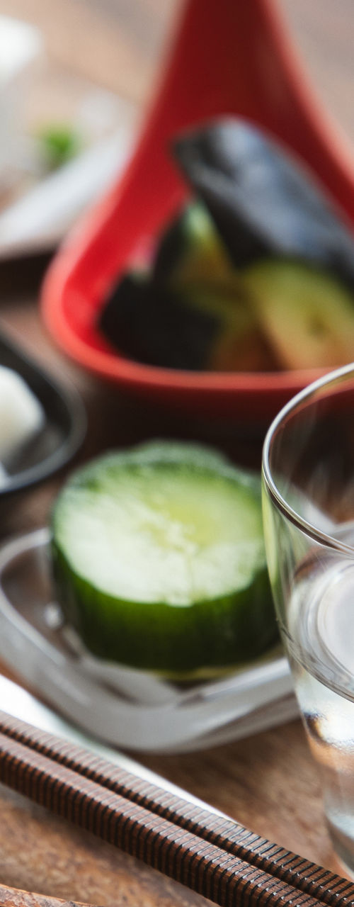 Traditional Japanese sake with assorted appetizers on tray