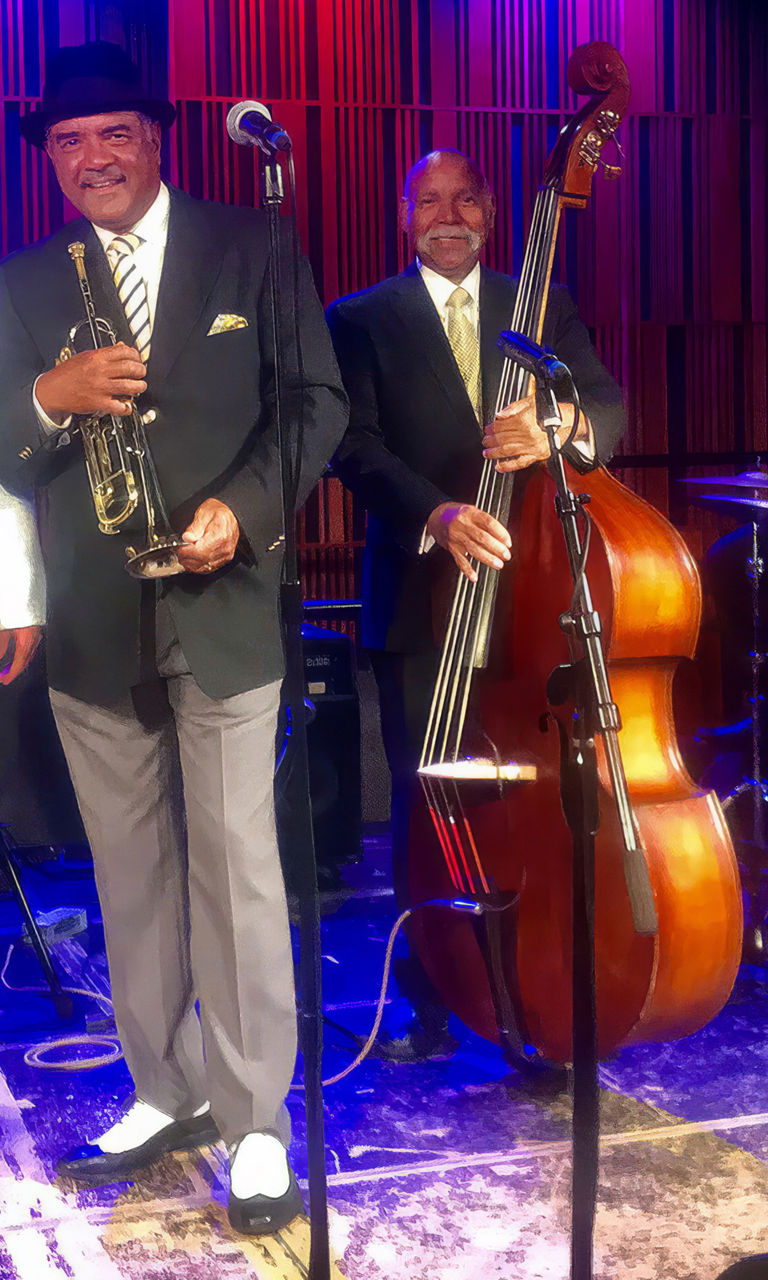 Jazz band performing on stage with instruments