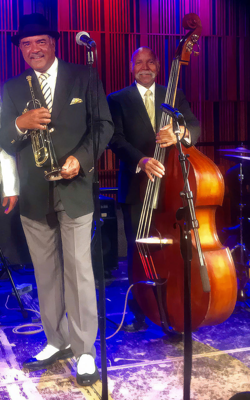 Jazz band performing on stage with instruments