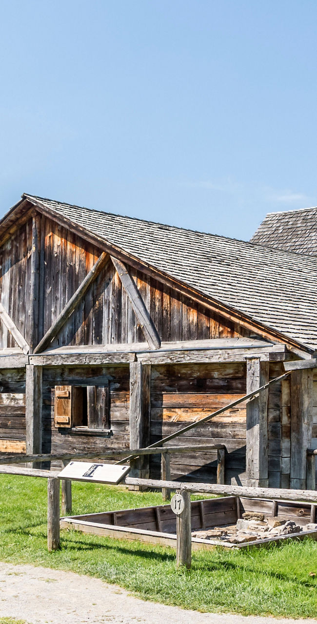 Historic wooden and stone buildings in sunlight