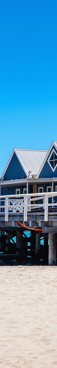 Wooden pier with beach and blue sky