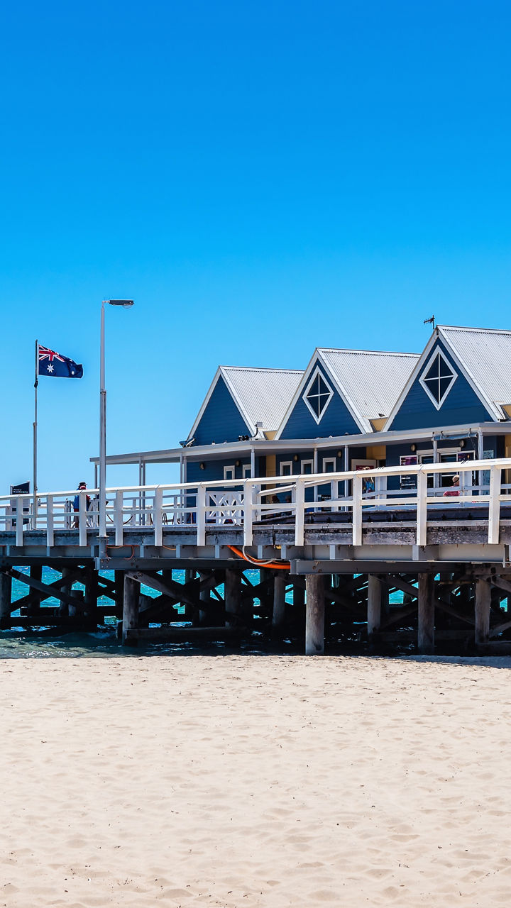 Wooden pier with beach and blue sky