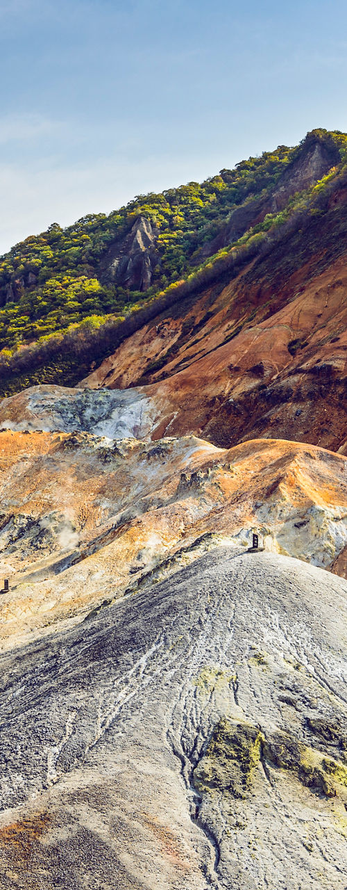 Colorful volcanic valley landscape with autumn foliage