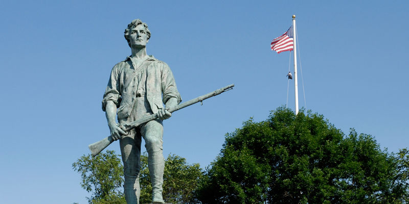 Historic soldier statue with American flag