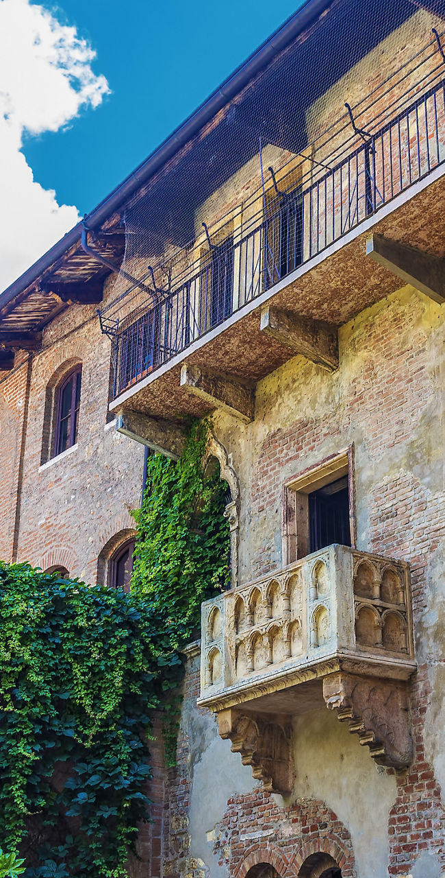 Historic Italian courtyard with ivy-covered walls